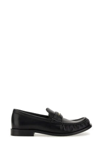 Burberry women’s black leather moccasin loafer with frayed edges and small metallic logo on the strap