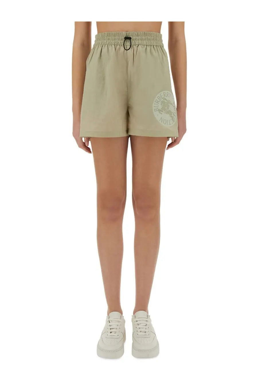 Burberry women’s beige nylon athletic shorts with drawstring waistband and circular logo patch on left thigh