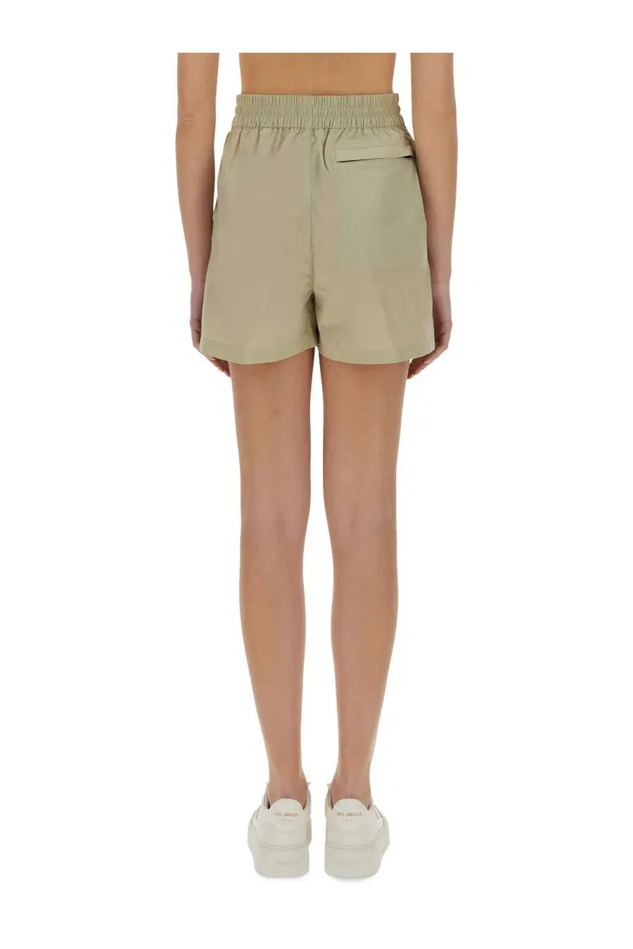 Back side view of burberry women’s beige nylon shorts with elastic waistband and single back pocket