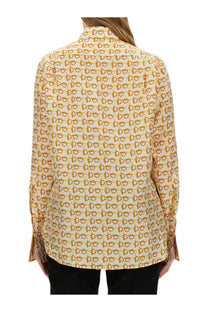 Burberry women’s beige cream-colored blouse with gold-toned eyeglass frame pattern and lightweight fabric
