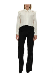 Burberry women’s cream-colored satin silk blouse with structured shoulders and long sleeves