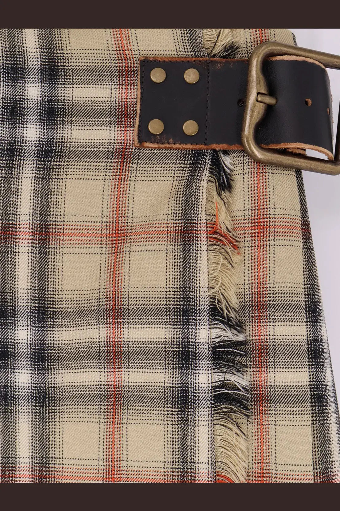 Burberry women’s Skye cotton kilt in beige black and red plaid with frayed hem and dark brown leather belt buckle