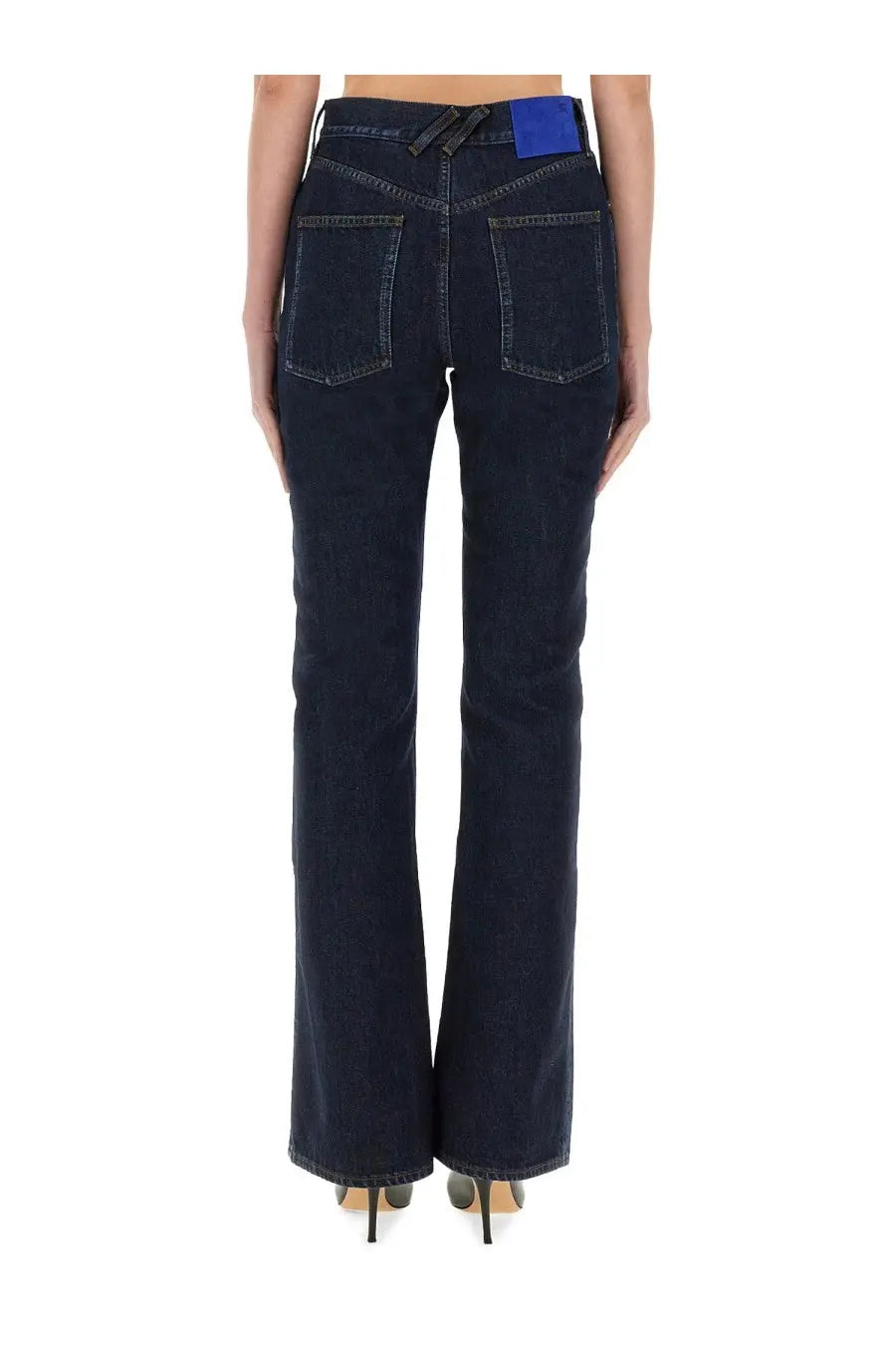 Burberry women’s straight blue denim jeans with dark indigo flare and blue waistband label shown from the back side