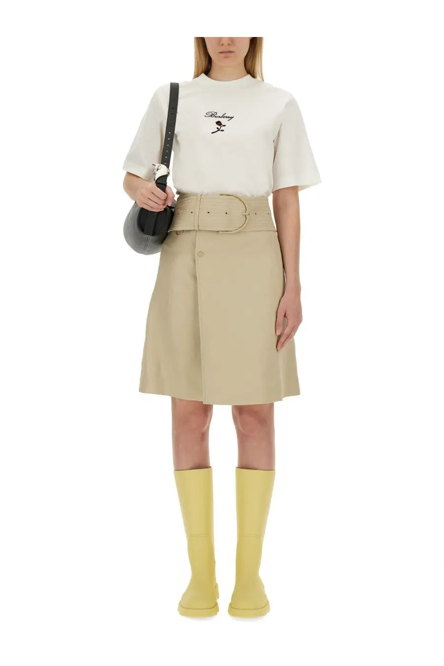 Beige Burberry women’s trench skirt with pleats, matching belt, and button closure in soft fabric