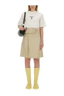 Beige Burberry women’s trench skirt with pleats, matching belt, and button closure in soft fabric