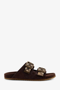 Burberry women’s Urchin brown suede slide sandal with two tan and beige plaid buckle straps in white background