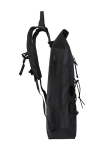 Black waterproof roll-top backpack by c.p. company with adjustable shoulder straps and side compression cords shown from back