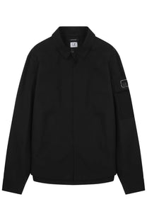 Black c.p. company men’s giacca metropolis overshirt in black featuring lightweight fabric and front pockets
