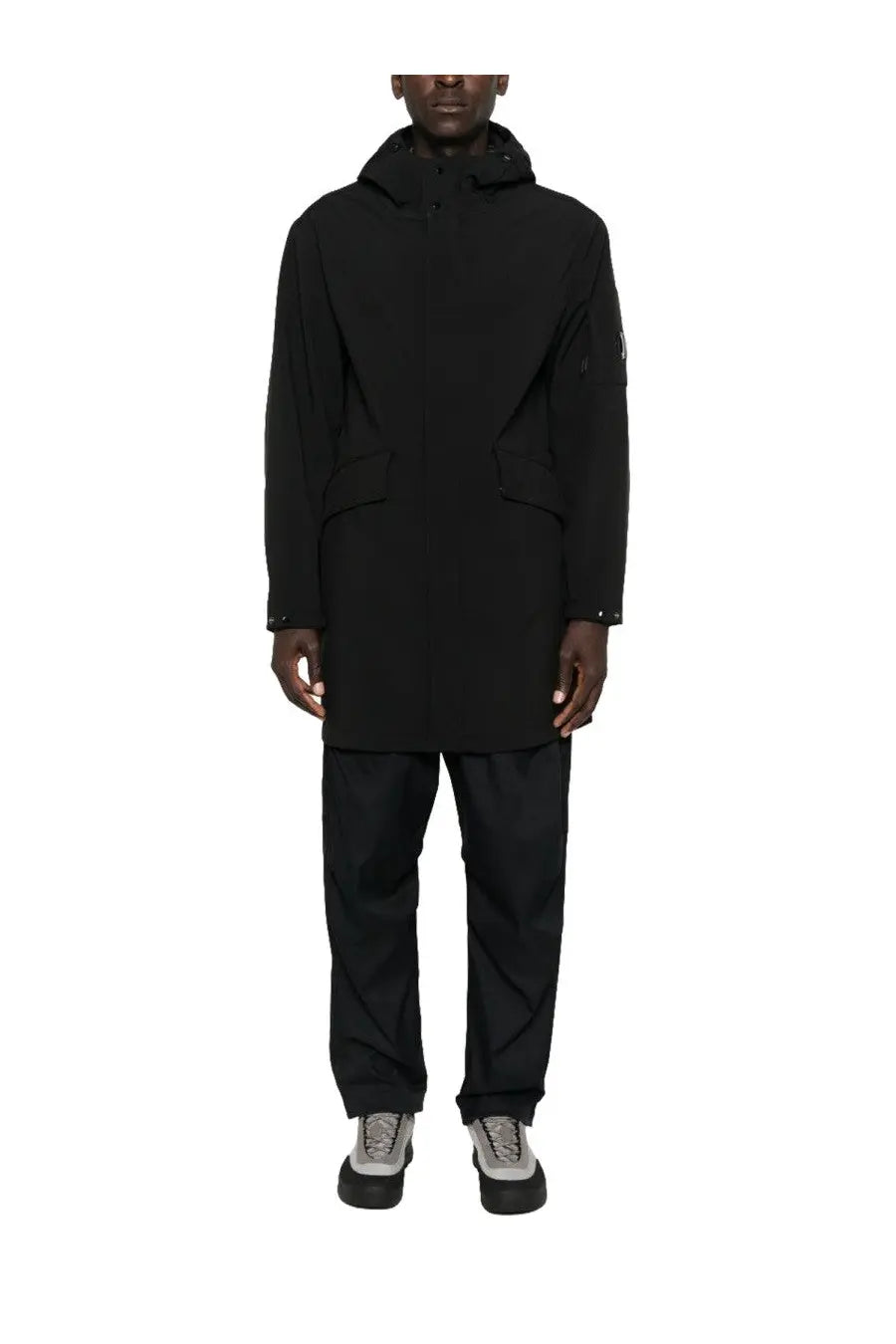 C.p. company men’s black hooded parka with a sleek minimalist trench coat design and subtle sleeve branding