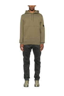 C.P. Company men’s olive green hooded sweatshirt with front pocket and small circular logo on left sleeve