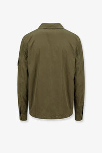 Olive green nylon shirt jacket by c.p. company with subtle texture and reinforced seams for durability