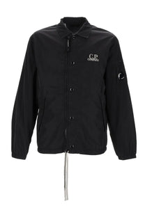 Black c.p. company men’s overshirt in chrome black showing lightweight cotton fabric and front button design