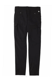 Black cargo pants by C.P. Company with two large side pockets and brand tag on the waistband