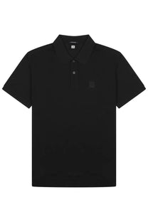 Black short-sleeved polo shirt by c.p. company with subtle textured fabric and small square logo on left chest