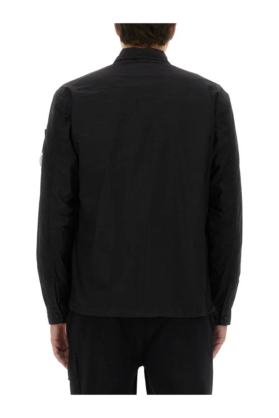 C.P. Company men’s black long-sleeved jacket with structured collar and subtle seam detailing
