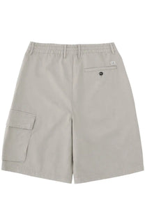 Beige c.p. company men’s cargo shorts with elastic waistband and branded patch on the back pocket shown from behind