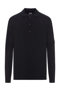 C.P. Company men’s black wool polo with long sleeves, classic collar, three buttons, and subtle textured knit fabric