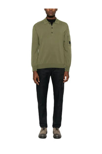 C.P. Company men’s olive green wool long-sleeved polo shirt with buttoned placket and black logo patch on sleeve