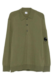 Olive green men’s wool polo shirt by C.P. Company with long sleeves black buttons and logo patch on left sleeve