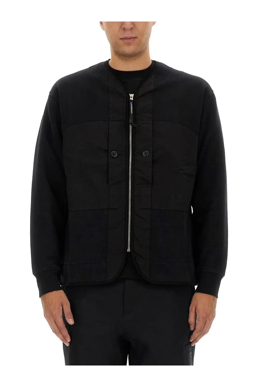 C.P. Company men’s black utility jacket with central zipper and two front pockets featuring subtle chest branding