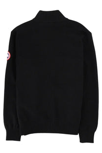 Black canada goose men’s giacca in maglia hybridge turtleneck sweater with red and white logo patch on left sleeve