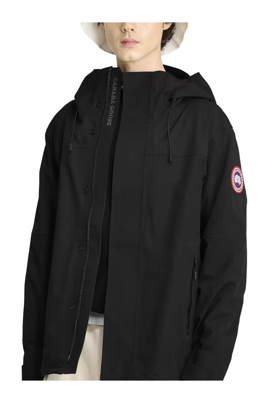Canada Goose men’s rain jacket rupert black with hood and red and white logo patch on the sleeve