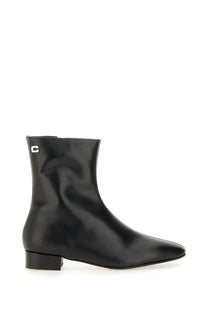 Carel Paris women’s ankle boot aiglon black made of sleek black patent leather with pointed toe and low block heel