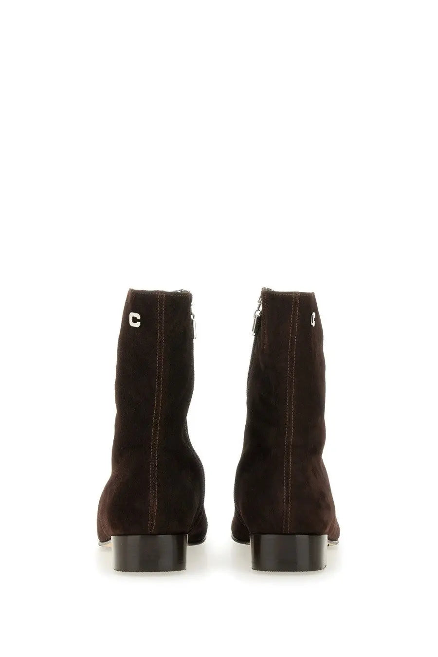 Dark brown suede ankle boots with low block heel and silver c logo on the back carel paris women’s aiglon brown