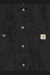 Carhartt Wip men’s black denim jacket with subtle camouflage pattern and silver-toned buttons in green style