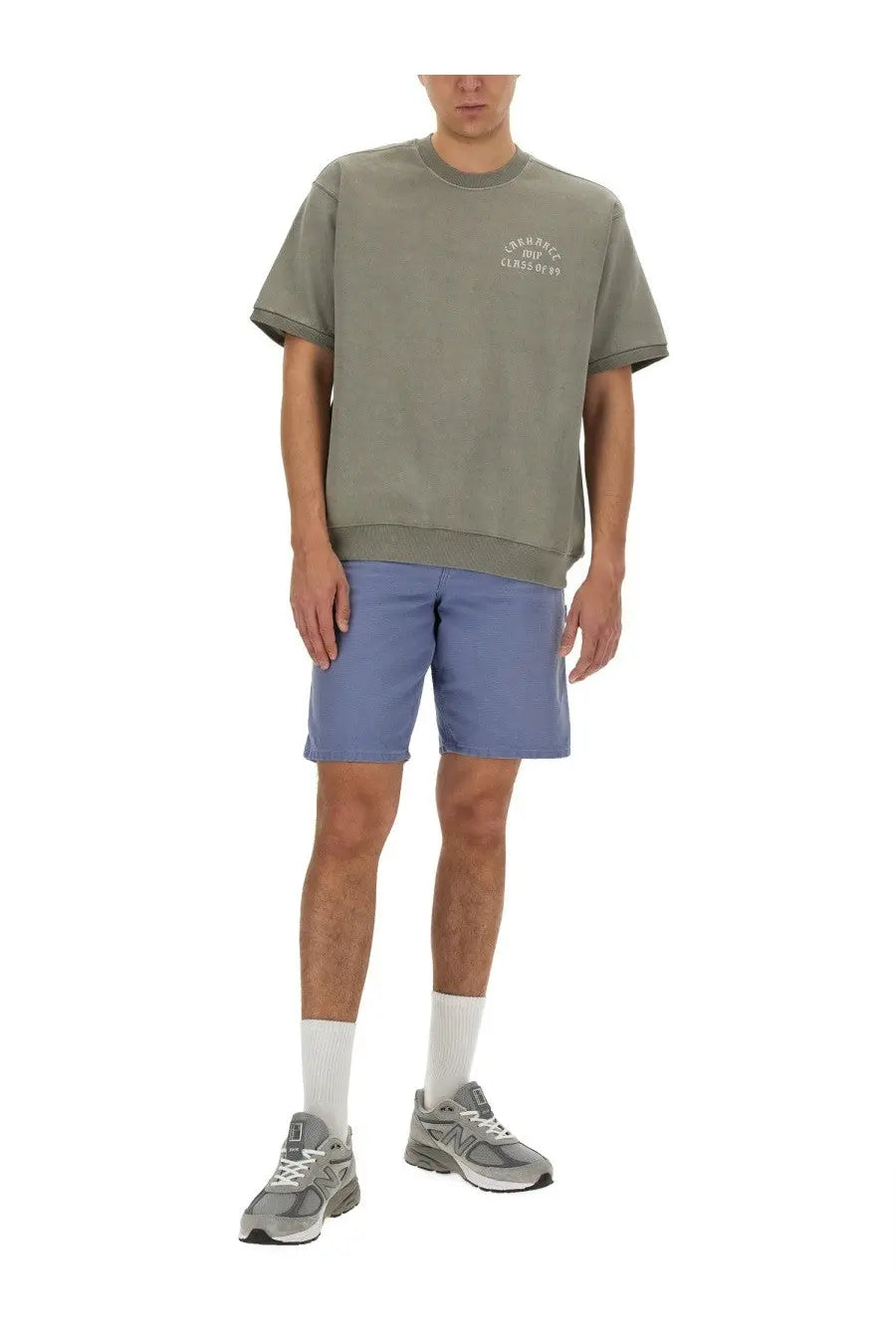 Olive green oversized crewneck sweatshirt with subtle white embroidered logo paired with carhartt wip men’s bermuda shorts columbia blue