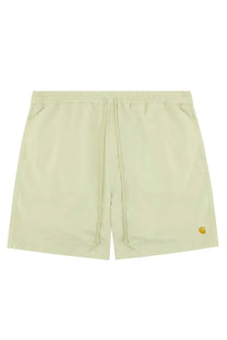 Light green carhartt wip men’s boxer swimsuit with drawstring shorts and small yellow logo on lower right leg