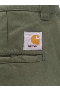 Olive green carhartt wip men’s brady cotton cargo trousers with white label and orange logo stitching detail