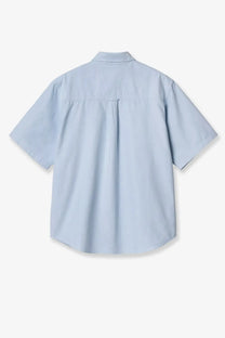Light blue short-sleeved carhartt wip men’s braxton cotton shirt with classic collar and back pleat shown from the back
