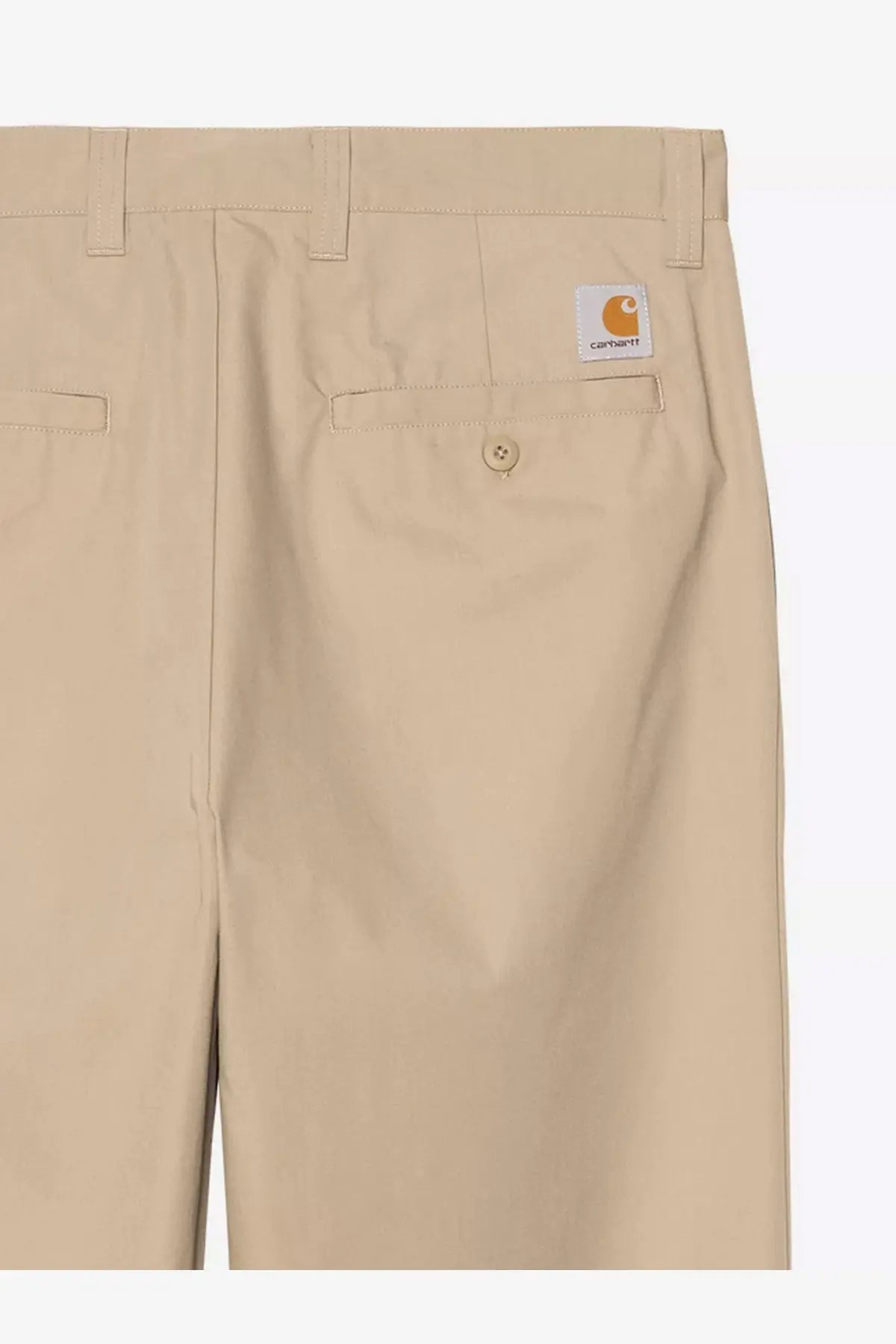 Back view of beige carhartt wip men’s calder cotton blend trousers with white label and orange logo on pocket