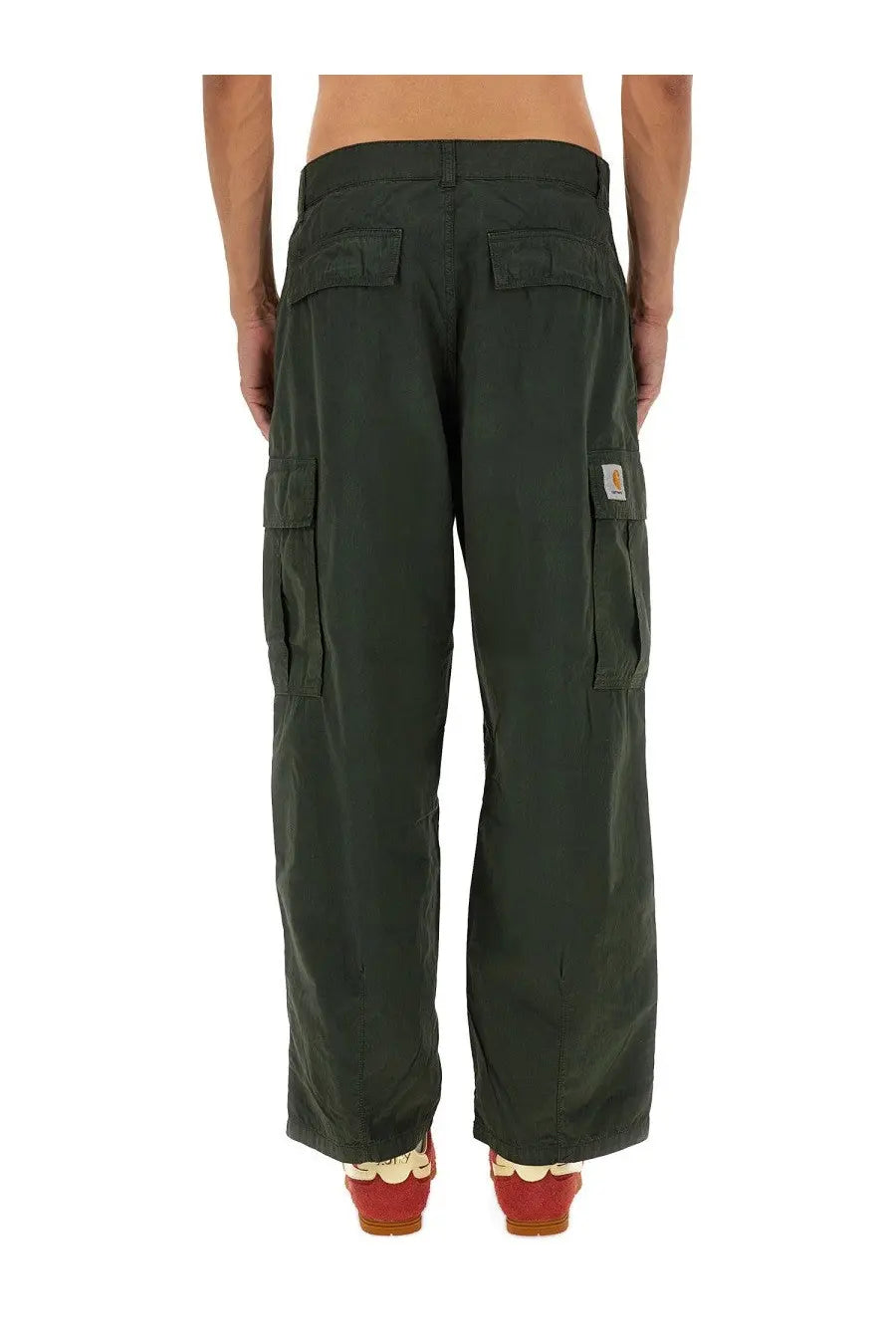 Carhartt wip men’s dark green cargo pants with multiple pockets and a thigh logo patch