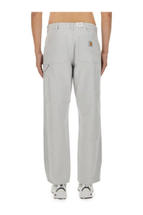 Carhartt Wip men’s light gray cargo pants with multiple pockets and classic workwear design in durable fabric