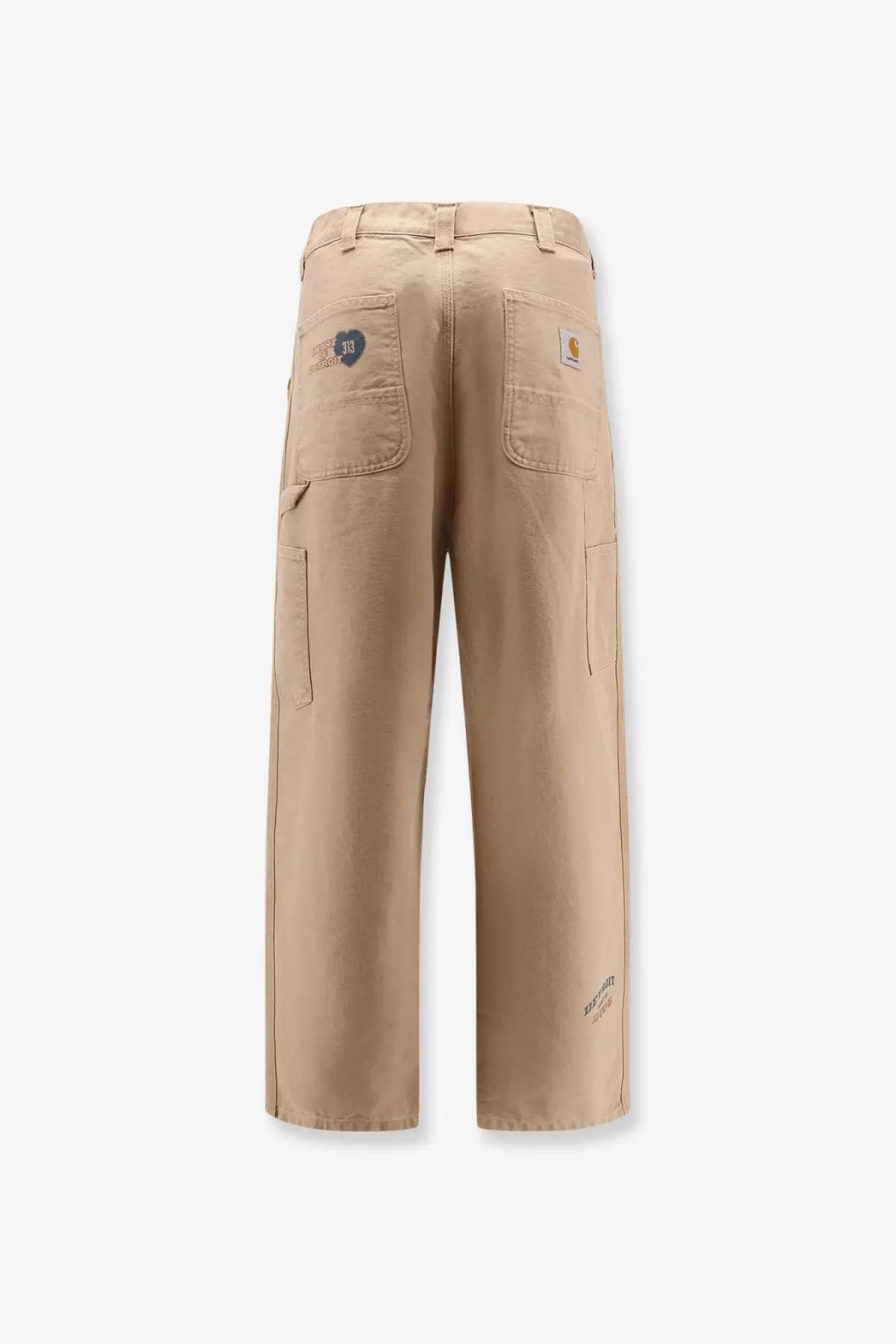 Beige carhartt work pants with multiple pockets and a classic rugged design made from durable fabric