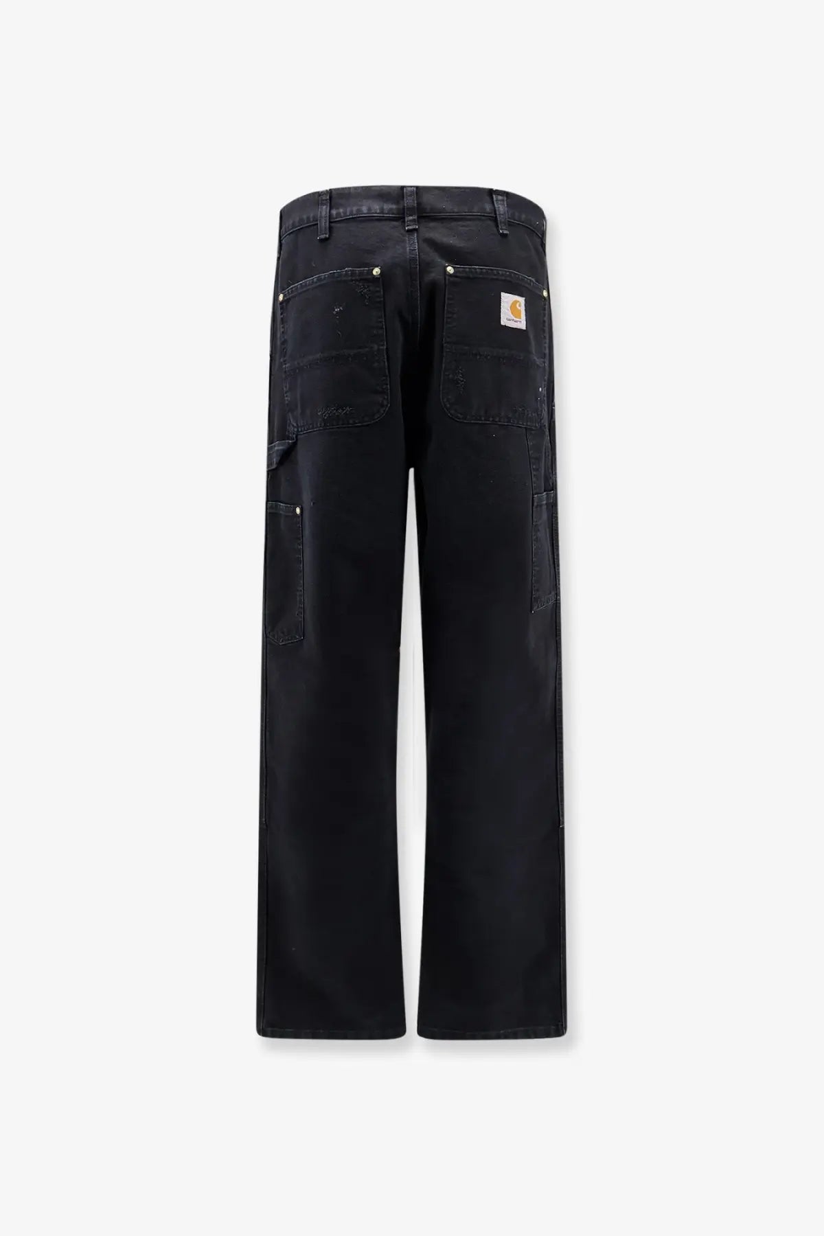 Back side of black carhartt wip men’s double knee denim trousers with multiple pockets and branded patch