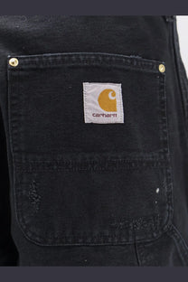 Black carhartt wip men’s double knee denim trousers with white label and red embroidered orange logo