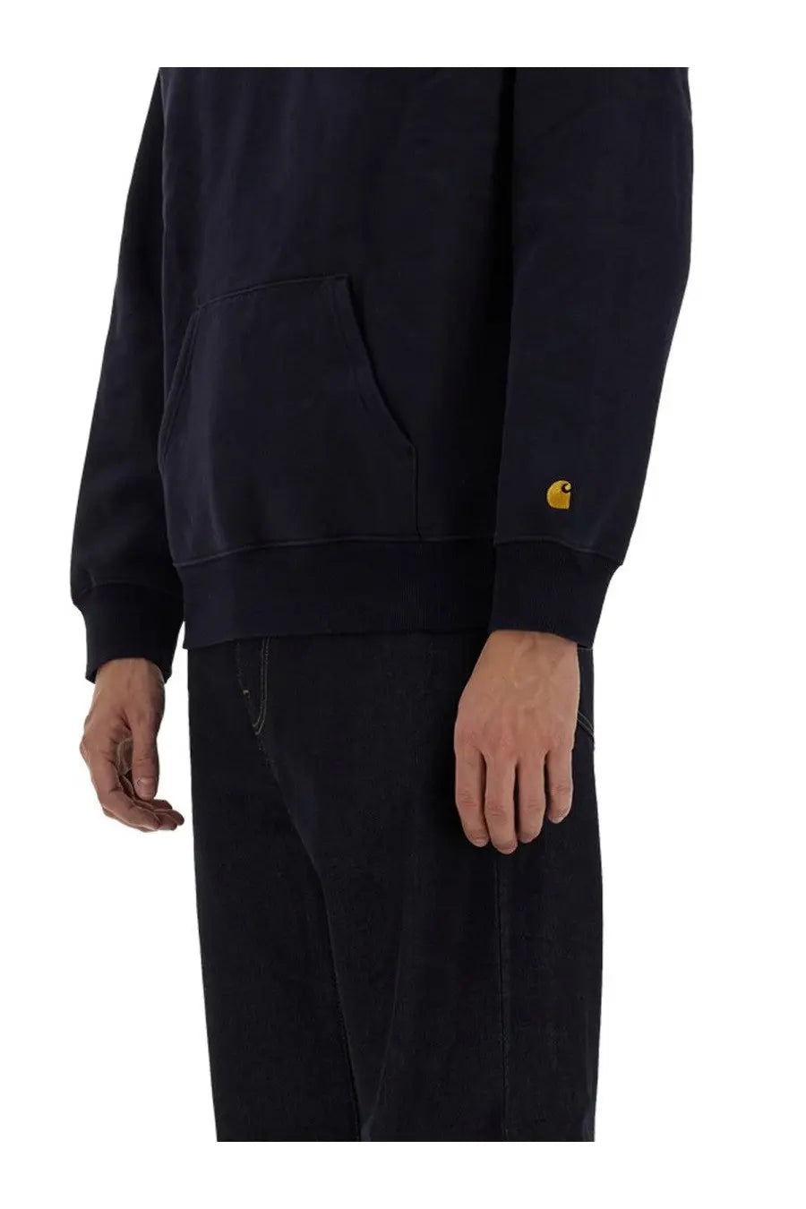 Dark navy carhartt wip men’s half zipper sweatshirt with gold logo patch on left sleeve in durable fabric