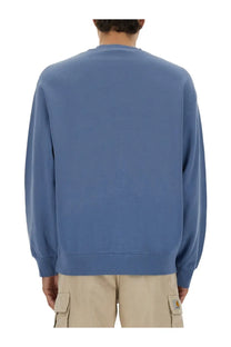 Carhartt Wip men’s jersey sweatshirt in Hudson blue with ribbed cuffs and hem made from durable fabric