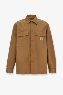 Tan Carhartt Wip men’s Kelly cotton work shirt with buttoned chest pockets and branded patch on left breast