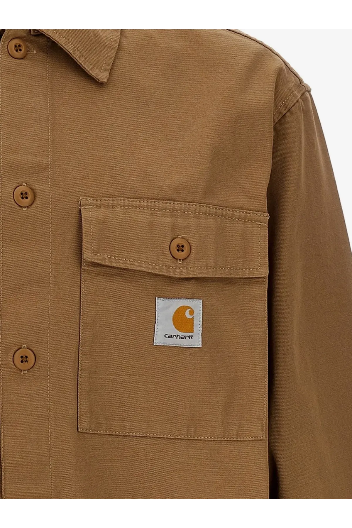 Tan carhartt work shirt with a chest pocket and orange white logo patch in beige cotton from carhartt wip mens kelly collection