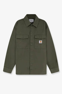 Olive green Carhartt Wip men’s Kelly cotton work shirt with two chest pockets and branded patch on left pocket