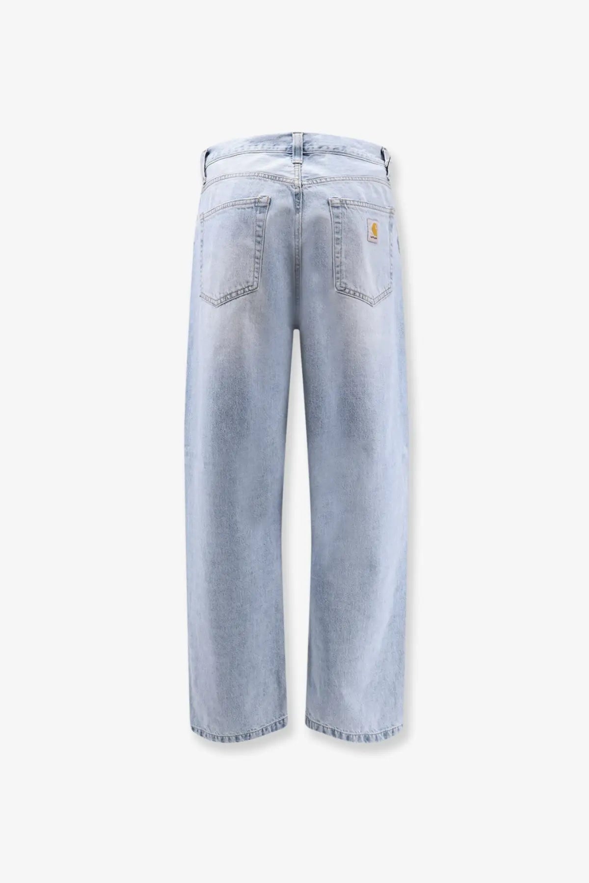 Back side of carhartt wip men’s landon denim jeans in light-wash blue with relaxed wide-leg cut and yellow logo patch