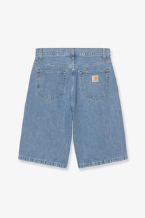 Back side of light-wash carhartt wip men’s langdon blue denim bermuda shorts with classic logo patch on pocket