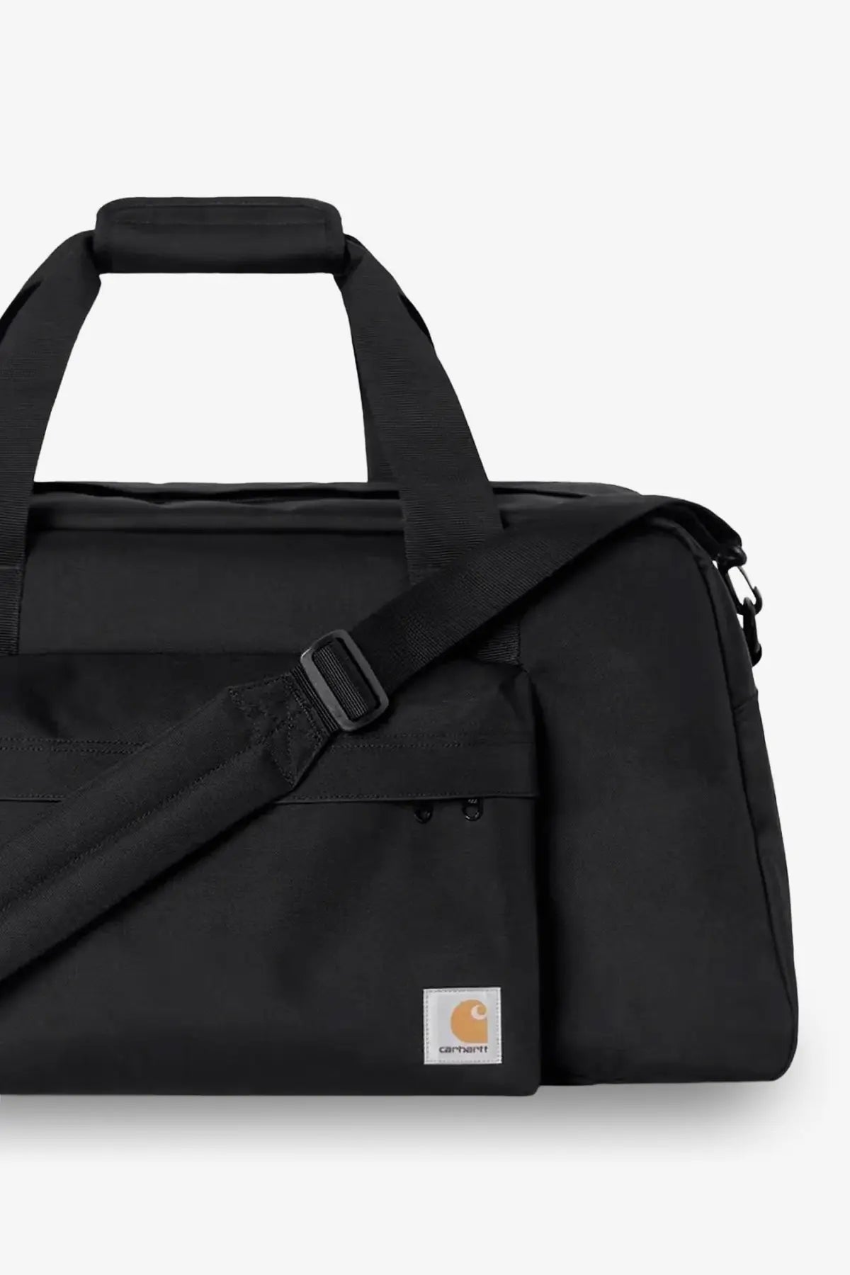 Black Carhartt Wip men’s nylon duffel bag with sturdy fabric and contrasting orange logo patch