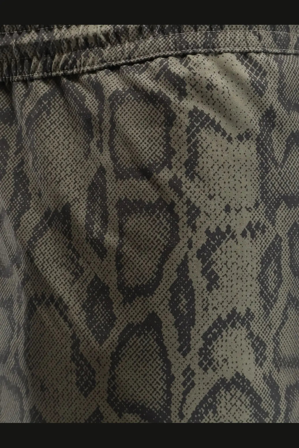 Carhartt Wip men’s nylon swim boxer shorts in olive green and black snake print fabric front view