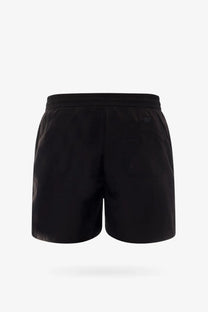 Carhartt Wip men’s nylon swim trunk in black with elastic waistband and sleek minimalist design