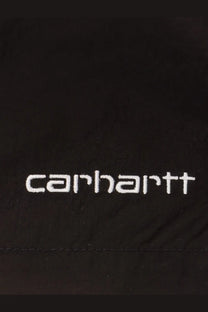 Black carhartt jacket with white embroidered logo paired with carhartt wip men’s black nylon swim trunk